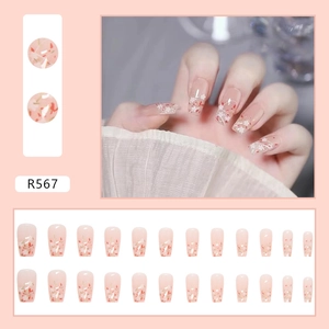 Detail of R567 French press-on nails with white flowers and red flecks, 24-piece set