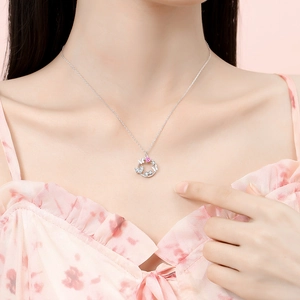 S925 silver necklace with butterfly pendant and pink heart gem on model