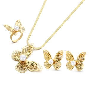 Elegant gold-plated butterfly jewelry set with pearls including necklace earrings and ring