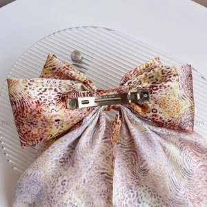Large vintage leopard print silk bow hair clip with silver spring metal fastener