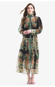 Close-up of lantern sleeve details and vintage paisley print on long-sleeved dress