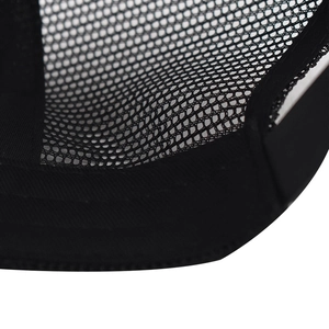 Detailed close-up of the breathable black mesh material on the trucker baseball cap