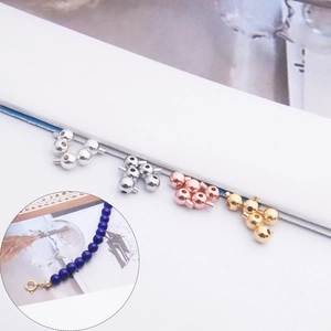Macro detail of S925 sterling silver bead clasp connectors in four diverse metallic colors