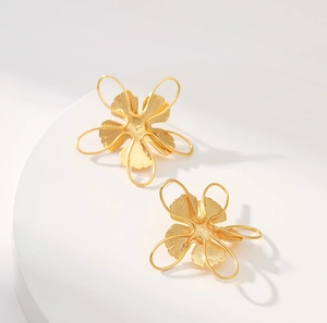Creative 18K gold plated brass woven flower earrings with elegant metallic texture