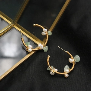Handmade gold wire hoop earrings with natural white pearls and light green stones