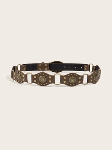 Detail of vintage brown PU leather belt with bronze metal rings and embossed studs