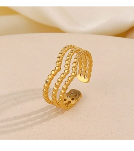 Detailed view of 18K gold plated triple-layer beaded open ring on a beige display stand