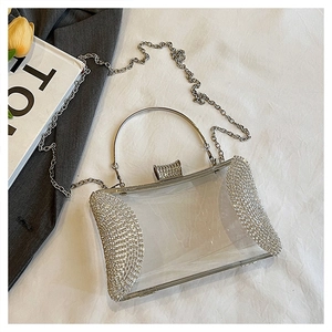 Macro detail of transparent acrylic evening bag with sparkling silver rhinestones