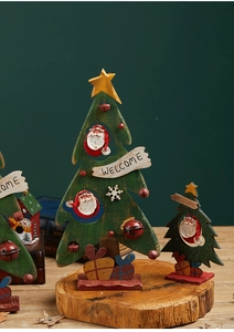 Detail of green wooden Christmas tree decor with Santa Claus and Welcome text