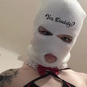 Close-up of white knitted 3-hole ski mask with Yes Daddy embroidery and red bows