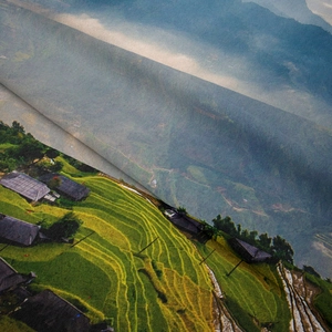 Close-up of bohemian wall tapestry showing rich fabric texture and mountain terrace scenery