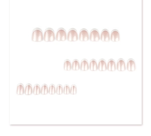 Flat lay of 24 pieces short round French manicure press-on nails with white tips on white background