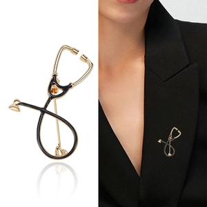 Creative gold stethoscope brooch for medical professionals on black suit lapel
