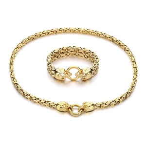 Golden Byzantine chain necklace and bracelet set with dual skull clasps and ring