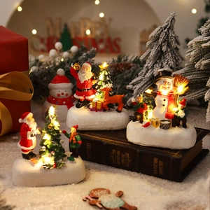 Glow-in-the-dark Christmas miniatures set with Santa Claus and LED snow base for desktop