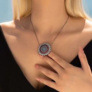 Elegant S925 silver necklace with sparkling blue and red sunflower pendant on model
