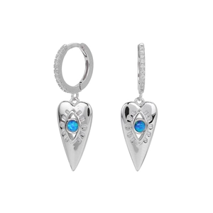 Detail of silver heart earrings with blue stone center and cubic zirconia pave