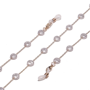 Gold eyewear chain necklace featuring round white pearls and adjustable rubber ends