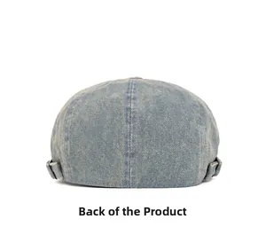 Rear view of light blue washed denim skull cap showing fabric texture and stitching