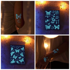 Luminous temporary butterfly tattoo stickers for arm and body with glowing floral patterns