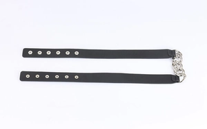 Close-up of black leather waist belt featuring silver metal chains and snap button details