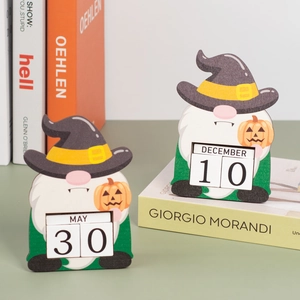 Detail of wooden gnome countdown calendar with manual month and date flip tiles