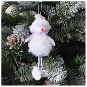 Close-up of a white plush snowman hanging ornament on a dark green Christmas tree