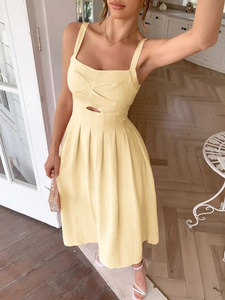 Elegant yellow halter midi dress with cut-out waist and pleated skirt for summer vacations