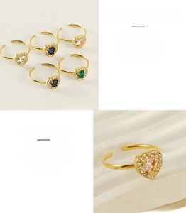 Detailed view of adjustable 18K gold-plated stainless steel rings with heart-shaped zircons