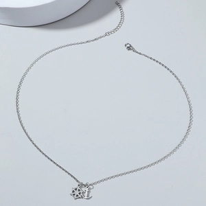 Polished stainless steel nautical necklace featuring anchor and helm pendants for men