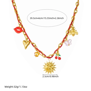 Summer gold necklace with sun, cherry, and heart charms on a red rope and chain