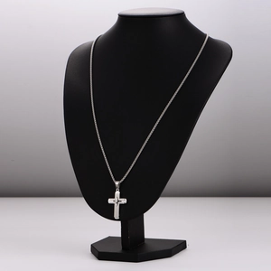 Silver stainless steel double layer cross pendant necklace displayed on black bust