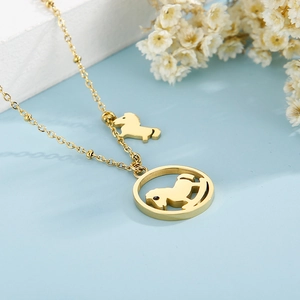 Detailed close-up of a gold-plated O-chain necklace with a hollow rocking horse pendant