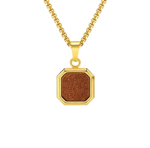 Macro detail of 18K gold-plated octagonal pendant with sparkling goldstone inlay