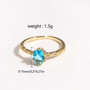 Minimalist gold ring featuring a 5x7mm sky blue zircon stone with adjustable open band