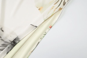 Detail view showing delicate floral mesh fabric with premium stitching and soft yellow lining