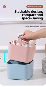 Close-up of stackable plastic organizers with compartments and portable handles for storage