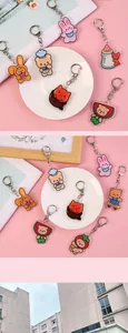 Close-up of cute acrylic cartoon bear keychain with colorful charms and metal hook