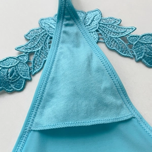 Sky blue water-soluble lace thong featuring delicate floral embroidery detail