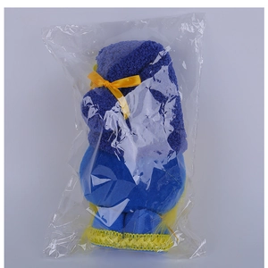 Blue and yellow sunflower gnome plush doll securely packaged in clear protective wrap