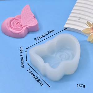 Macro view of heart-shaped rose and butterfly silicone cake mold with size measurements