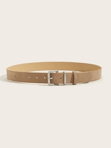 Macro shot of light brown suede wide belt featuring a square silver metal buckle