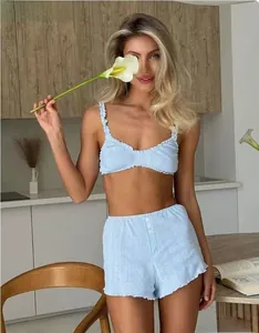Detail of light blue waffle texture lounge set with camisole and high-waist shorts