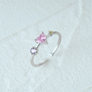Close-up of S925 silver butterfly flower ring with pink heart gem and color stones