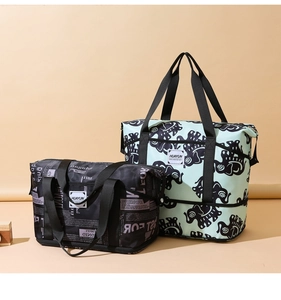 Detailed comparison of mint green and black printed travel bags in two sizes