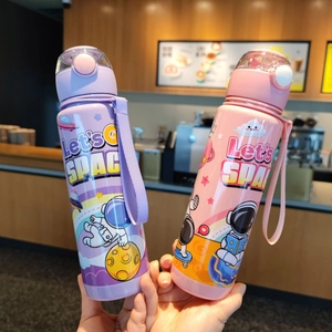 Detail of pink and purple cartoon astronaut water bottles with pop-up lids and carry straps