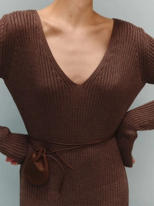 Close-up of brown rib-knit dress with deep V-neck and leather waist belt with mini pouch
