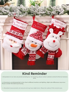 Detailed view of three hanging Christmas stockings with Santa, Snowman and Reindeer dolls