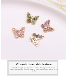 Macro detail of butterfly jewelry pendants with micro-set zircon in gold-plated copper