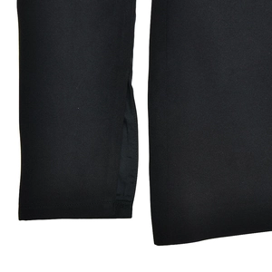 Detailed macro shot of the black dress sleeve cuff featuring a stylish slit design detail
